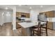 Modern kitchen island featuring a white countertop, stainless steel appliances, and stylish seating at 171 Sara St, Saint George, SC 29477