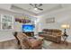 Cozy living room with a ceiling fan, and a large TV for entertainment at 171 Sara St, Saint George, SC 29477