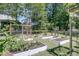 Well-maintained backyard garden with raised planting beds, offering a perfect space for gardening enthusiasts at 1828 S James Gregarie Rd, Mount Pleasant, SC 29466
