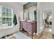 Charming bathroom with decorative wallpaper, vessel sinks, and unique vanity at 1828 S James Gregarie Rd, Mount Pleasant, SC 29466