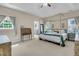 Spacious primary bedroom features a four-poster bed, neutral tones, and lots of natural light at 1828 S James Gregarie Rd, Mount Pleasant, SC 29466