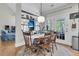 Charming dining area with hardwood floors, modern lighting, and easy access to a cozy living room at 1828 S James Gregarie Rd, Mount Pleasant, SC 29466