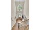 Grand foyer featuring a wooden door, hardwood floors, and a window above allowing natural light to flood the space at 1828 S James Gregarie Rd, Mount Pleasant, SC 29466