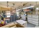 Organized garage featuring workbenches, tool storage, and overhead racks for efficient storage solutions at 1828 S James Gregarie Rd, Mount Pleasant, SC 29466