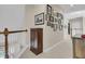 Hallway with carpet and neutral paint and a collection of framed artwork on the wall at 1828 S James Gregarie Rd, Mount Pleasant, SC 29466