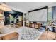 Spacious living room with a movie projector and lots of natural light at 1828 S James Gregarie Rd, Mount Pleasant, SC 29466