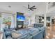 Inviting living room featuring a fireplace, hardwood floors, comfortable seating, and seamless flow into dining area at 1828 S James Gregarie Rd, Mount Pleasant, SC 29466