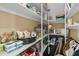 Well-stocked pantry with organized shelves holding various food items and household supplies at 1828 S James Gregarie Rd, Mount Pleasant, SC 29466
