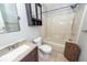 Cozy bathroom with shower and tub combo, vanity, and built-in storage at 2001 Baltusrol Ct, Summerville, SC 29483