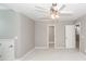 Neutral bedroom featuring a ceiling fan, carpet flooring, and bright light at 2001 Baltusrol Ct, Summerville, SC 29483