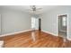 Spacious bedroom with hardwood floors, natural light and an ensuite bathroom at 2001 Baltusrol Ct, Summerville, SC 29483
