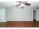 Spacious bedroom featuring hardwood floors and a ceiling fan, perfect for a cozy retreat at 2001 Baltusrol Ct, Summerville, SC 29483