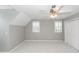 Bedroom with a ceiling fan, two windows with shutters, and a closet at 2001 Baltusrol Ct, Summerville, SC 29483