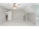 Bedroom with a ceiling fan, two windows and three doors at 2001 Baltusrol Ct, Summerville, SC 29483