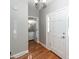 Inviting entryway with hardwood floors, and access to powder room and front door at 2001 Baltusrol Ct, Summerville, SC 29483