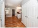 View of dining and kitchen through entryway with coat closet at 2001 Baltusrol Ct, Summerville, SC 29483