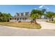 Charming traditional-style home featuring a welcoming wrap-around porch and well-manicured lawn at 2001 Baltusrol Ct, Summerville, SC 29483