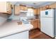 Traditional kitchen with light wood cabinets and white appliances at 2001 Baltusrol Ct, Summerville, SC 29483