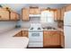 Traditional kitchen features light wood cabinets and bright natural light at 2001 Baltusrol Ct, Summerville, SC 29483