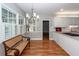Bright kitchenette with wood floors, stainless appliances, granite countertops and large windows with shutters at 2001 Baltusrol Ct, Summerville, SC 29483