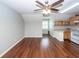 Living room with hardwood floors leads to a kitchen and another room at 2001 Baltusrol Ct, Summerville, SC 29483