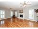 Large living room with fireplace, hardwood floors and lots of natural light at 2001 Baltusrol Ct, Summerville, SC 29483