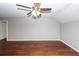 Empty living space features hardwood floors, a ceiling fan, and neutral walls at 2001 Baltusrol Ct, Summerville, SC 29483