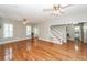 Bright and airy living room with hardwood floors and staircase to upper floor at 2001 Baltusrol Ct, Summerville, SC 29483