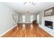 Open floor plan living room features a fireplace and staircase at 2001 Baltusrol Ct, Summerville, SC 29483