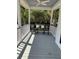 Inviting porch featuring rocking chairs, ceiling fan, and picturesque views, perfect for relaxation at 2001 Baltusrol Ct, Summerville, SC 29483