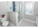 Modern glass-enclosed shower with sleek fixtures and stylish tile accents, enhancing the bathroom's appeal at 2001 Baltusrol Ct, Summerville, SC 29483