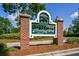 Pine Forest Country Club entrance featuring a vintage turtle sign, framed by brick columns at 2001 Baltusrol Ct, Summerville, SC 29483