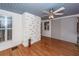 A sunroom with a brick accent wall, and hardwood floors at 2001 Baltusrol Ct, Summerville, SC 29483