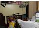 A cluttered bedroom with storage items, pictures, furniture, and cleaning supplies at 202 Easy, Goose Creek, SC 29445