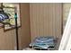 Bedroom with window, clothing rack, and art projects showcase a living space in need of decluttering at 202 Easy, Goose Creek, SC 29445