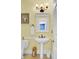 Well-lit powder room with pedestal sink, toilet, and tile flooring at 2021 Beckton St, North Charleston, SC 29420