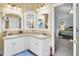 Bathroom with a double vanity and large mirror. It also provides access to the bedroom at 2021 Beckton St, North Charleston, SC 29420