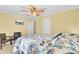 Airy bedroom with tropical-themed bedding, hardwood flooring, and a flat-screen TV at 2021 Beckton St, North Charleston, SC 29420