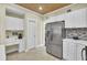 Modern kitchen features stainless steel appliances, white cabinetry and a built in desk at 2021 Beckton St, North Charleston, SC 29420