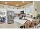 Modern kitchen featuring white cabinets, stainless steel appliances, and wooden ceiling at 2021 Beckton St, North Charleston, SC 29420
