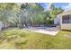 Backyard features a beautiful pool area, lush lawn and serene setting with mature trees at 2021 Beckton St, North Charleston, SC 29420