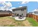 Spacious backyard featuring a pergola-covered dining area and fire pit, perfect for outdoor gatherings at 210 Witch Hazel St, Summerville, SC 29486