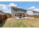 Expansive backyard featuring a patio with pergola, dining set, and fire pit, ideal for outdoor living at 210 Witch Hazel St, Summerville, SC 29486