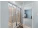 Modern bathroom featuring a glass-enclosed shower and adjacent bedroom creating a spa-like retreat at 210 Witch Hazel St, Summerville, SC 29486