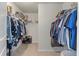 Walk-in closet with installed shelving and hanging rods providing ample storage solutions at 210 Witch Hazel St, Summerville, SC 29486