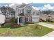 Beautiful two-story home with stone details and a well-maintained front yard at 210 Witch Hazel St, Summerville, SC 29486