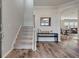 Spacious foyer showcasing staircase, wood floors, and an open floor plan at 210 Witch Hazel St, Summerville, SC 29486