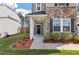 Charming front porch with decorative wreath and lush landscaping at 210 Witch Hazel St, Summerville, SC 29486