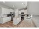Beautiful kitchen features white cabinets, granite countertops, stainless steel appliances, and hardwood floors at 210 Witch Hazel St, Summerville, SC 29486