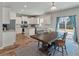 Open floorplan featuring kitchen, dining area, and access to the backyard for easy outdoor entertaining at 210 Witch Hazel St, Summerville, SC 29486